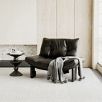 Fauteuil d'appoint contemporain en chenille noire capitonnée sans accoudoirs
