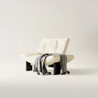 Fauteuil d'appoint contemporain en chenille noire capitonnée sans accoudoirs