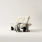 Fauteuil d'appoint contemporain en chenille noire capitonnée sans accoudoirs